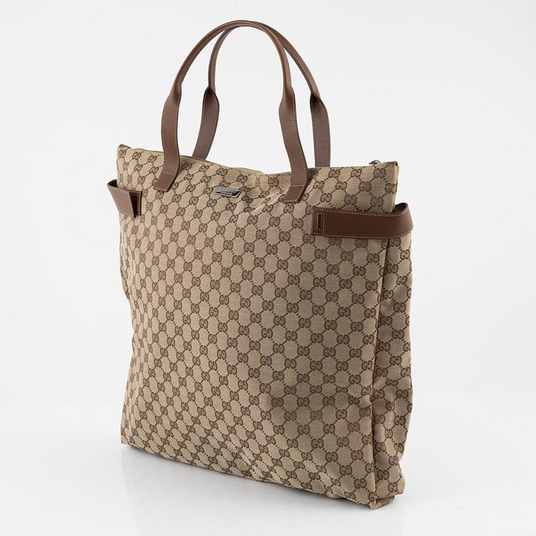 Gucci, a logo canvas tote bag.