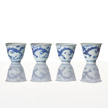 A set of four blue and white dragon wine cups, 'Hatcher Cargo', 17th century.