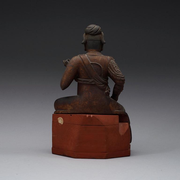 A gilt wooden figure of a deity, Ming dynasty.