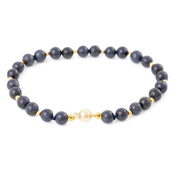 Bracelet with blue stones and 18K gold clasp.