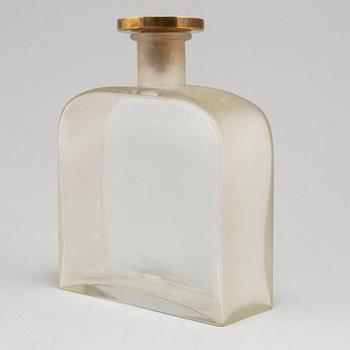 BJÖRN TRÄGÅRDH, a blasted glass bottle with a pewter and brass stopper,  Svenskt Tenn, Stockholm 1930's.