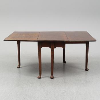 A two-piece mahogany gate leg table, 19th Century.
