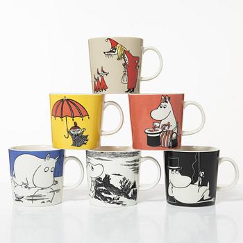 A set of 24 Moomin mugs, Arabia, Finland.