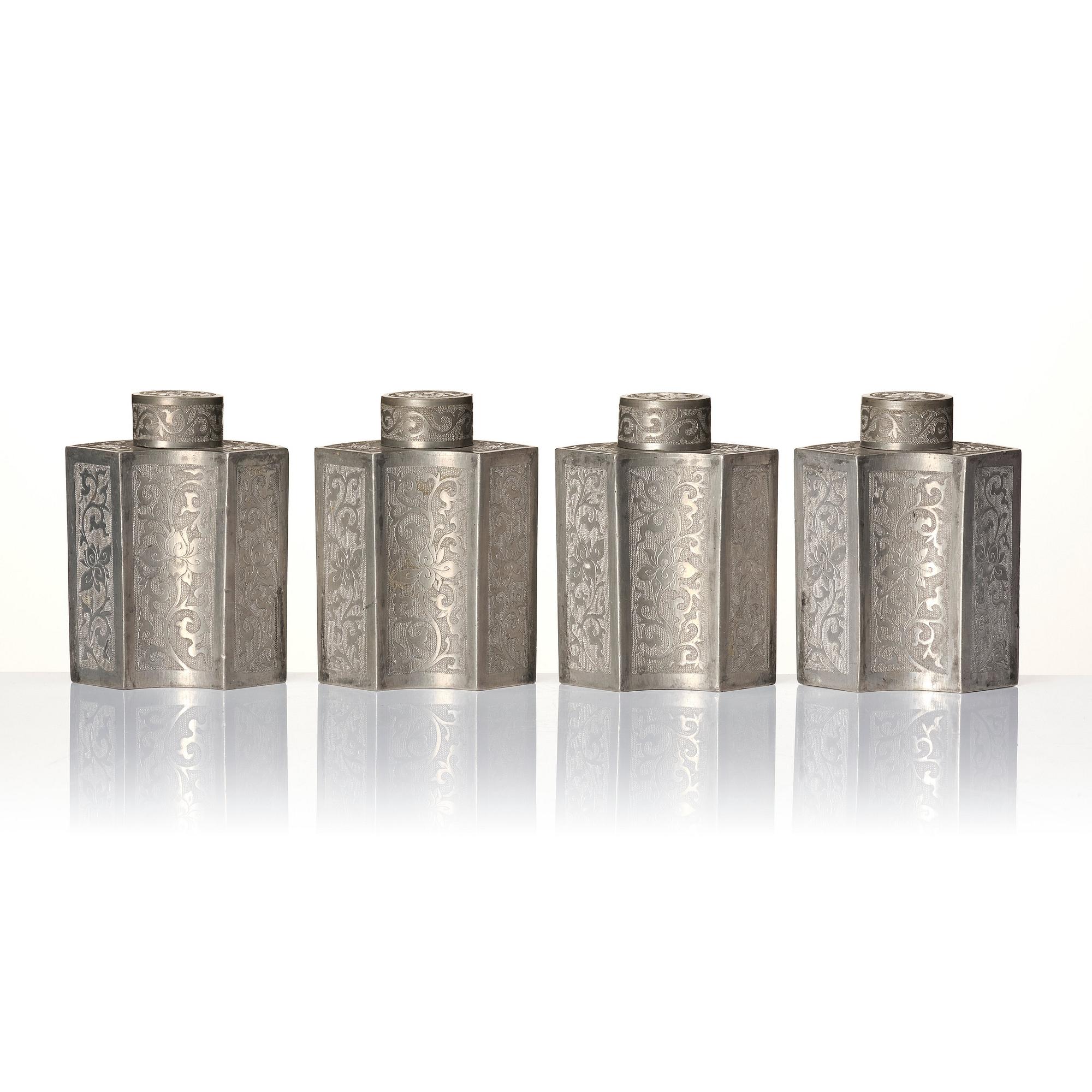 A Chinese lacquer box with a set of five pewter tea caddies, Qing dynasty, 18/19th Century.