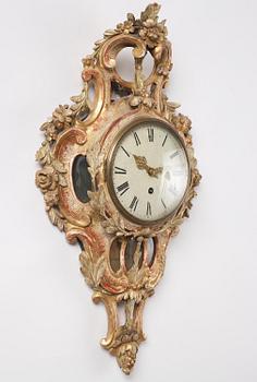 A Swedish Rococo giltwood cartel clock, Stockholm, later part of the 18th century.