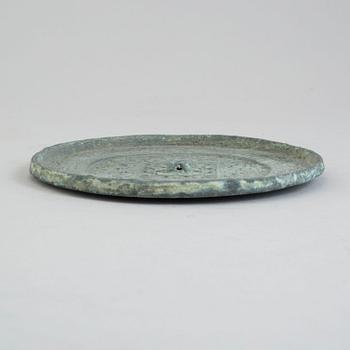 A bronze mirror, Xin-Eastern Han dynasty (9-220).
