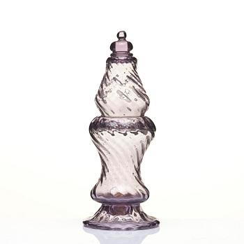 An amethyst coloured suger shaker and a cut glass goblet, 18th century.