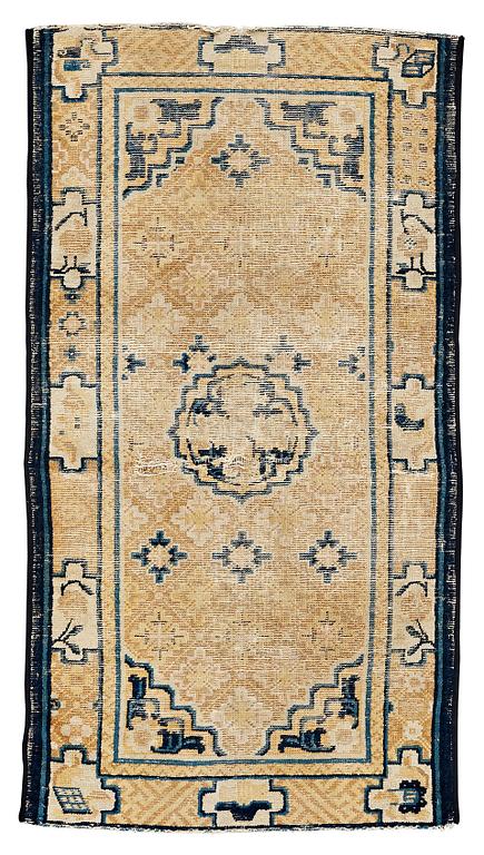 A RUG, an antique Ningxia, China, late Qing, ca 130 x 70,5 cm.