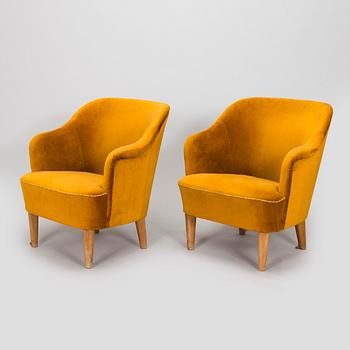 A pair of mid-20th century armchairs.