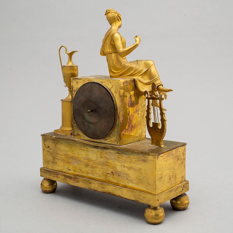 A first half of the 19th century Empire bronze mantle clock.