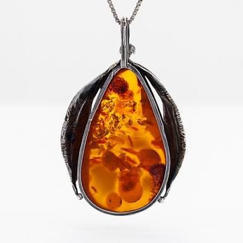 A silver and amber necklace, first half of the 20th century with later chain.