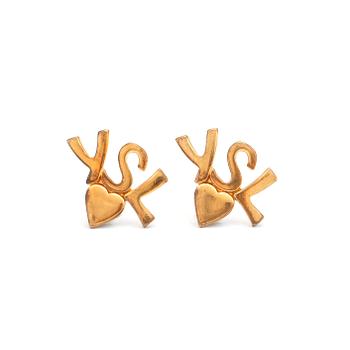 342. YVES SAINT LAURENT, a pair of gold colored logo earclips.