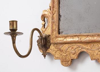 A Northern-European late Baroque two-light giltwood mirror sconce, first part of the 18th century.