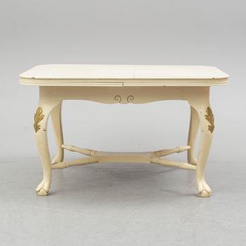 A dining table and six chairs, rococo style, mid 20th century.