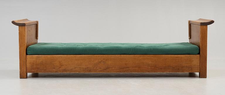 An Axel Einar Hjorth stained pine sofa 'Sandhamn', by Nordiska Kompaniet ca 1929.