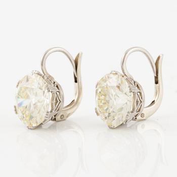A pair of earrings in 18K white gold set with two old-cut diamonds.
