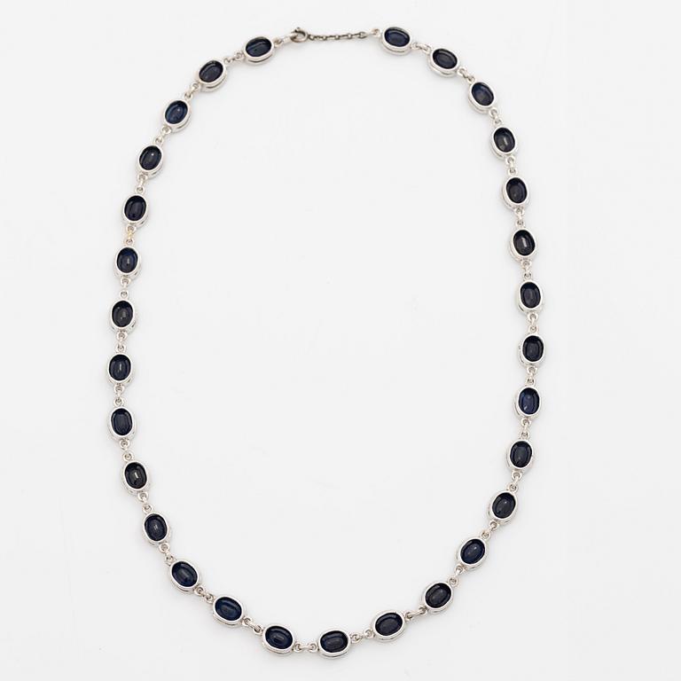 18K white gold necklace with dark sapphires.