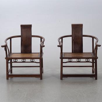 A pair of Chinese later part of the 20th century armchairs.