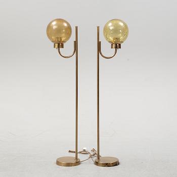 Bergboms, a pair of model 'G-118', brass and glass floor lamps. Second half of the 20th century.