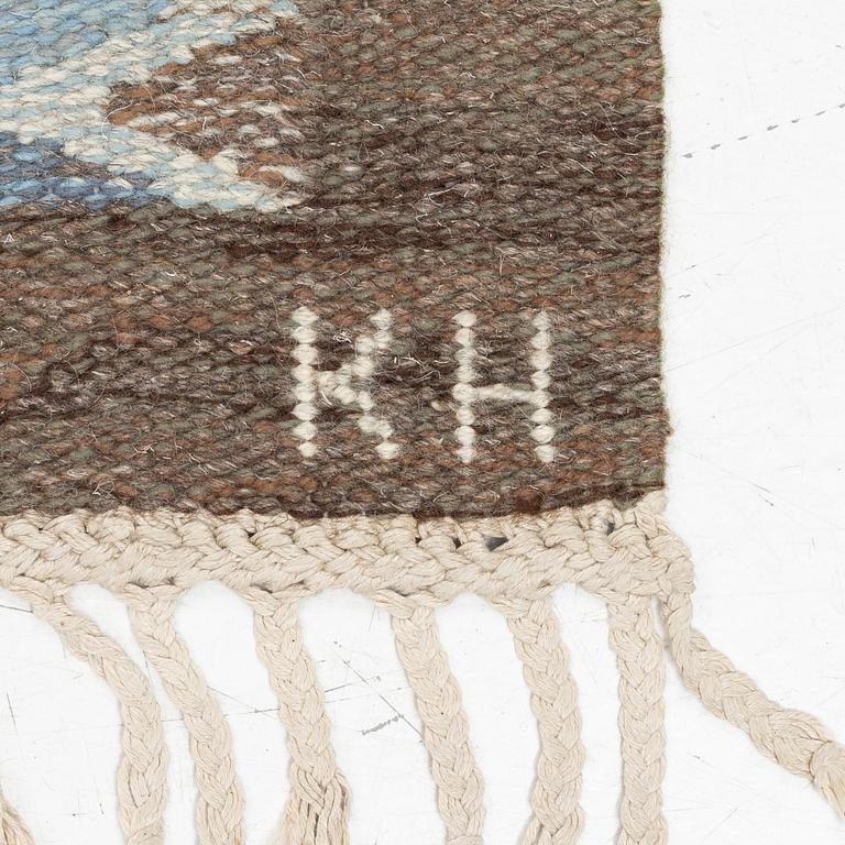 A flat weave carpet from Klockaregårdens Hemslöjd, Sweden, siged KH & NH, ca. 242 x 169 cm.