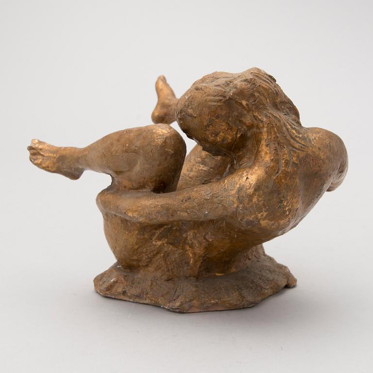 A gilt terracotta sculpture signed Matti Haupt.