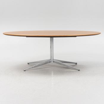 An 'Oval 96' table by Florence Knoll for Knoll International.