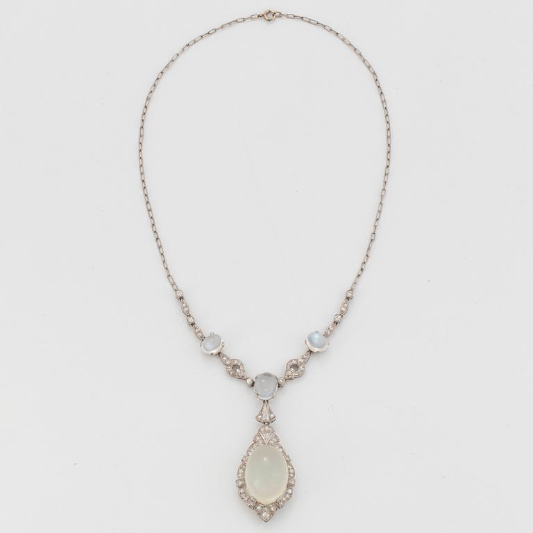 A platinum necklace set with moonstones and old- and eight-cut diamonds.