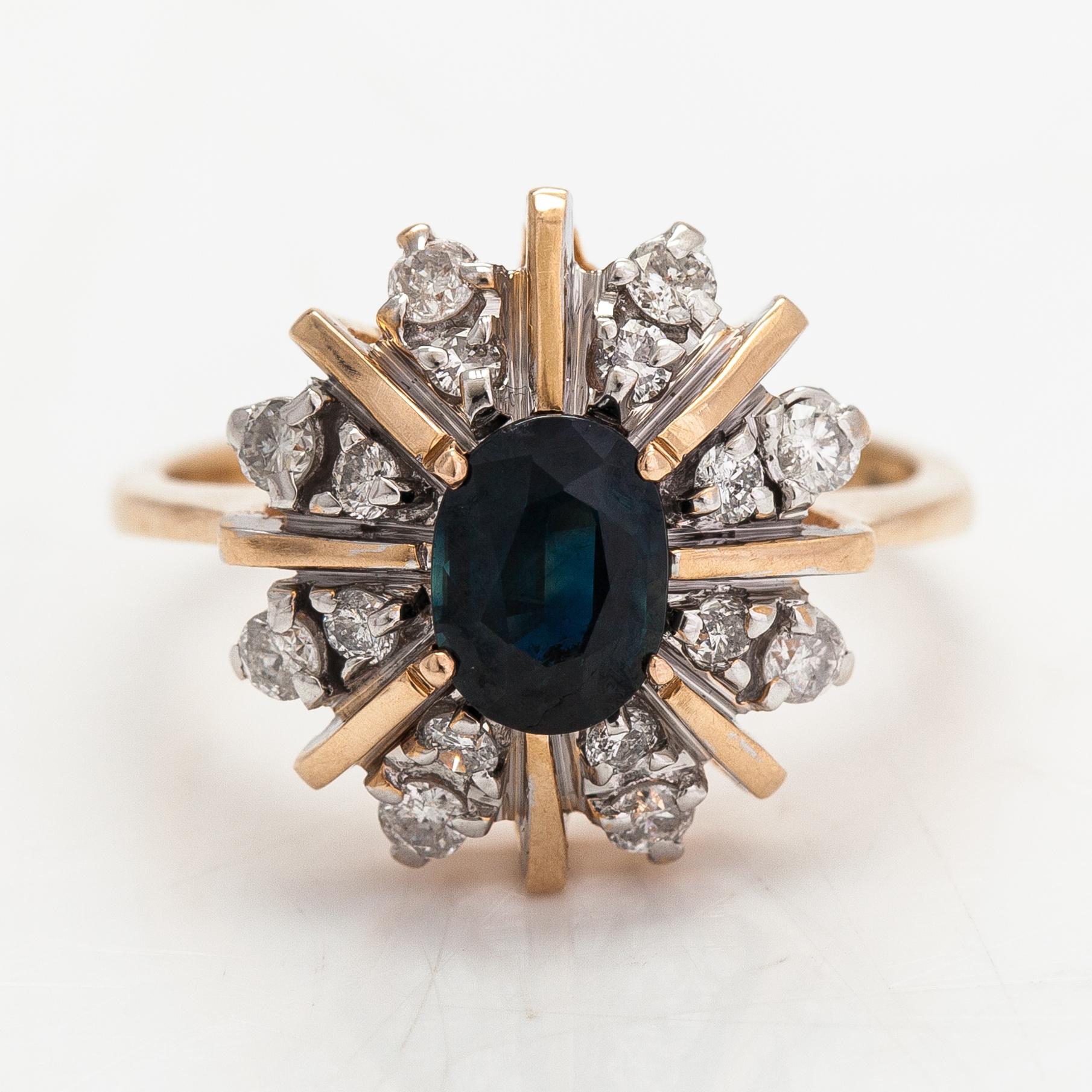A 14K gold ring with diamonds ca. 0.40 ct in total and a sapphire. Finland 1995.