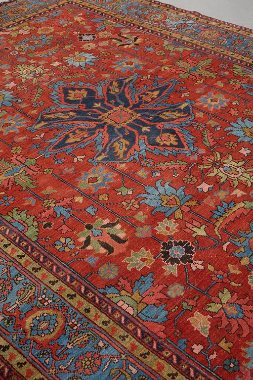 A carpet, an antique/semi-antique Heriz, ca 352 x 275 cm.