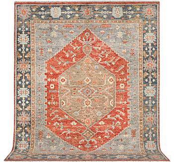 An oriental carpet with Mamluk design, c. 359 x 281 cm.