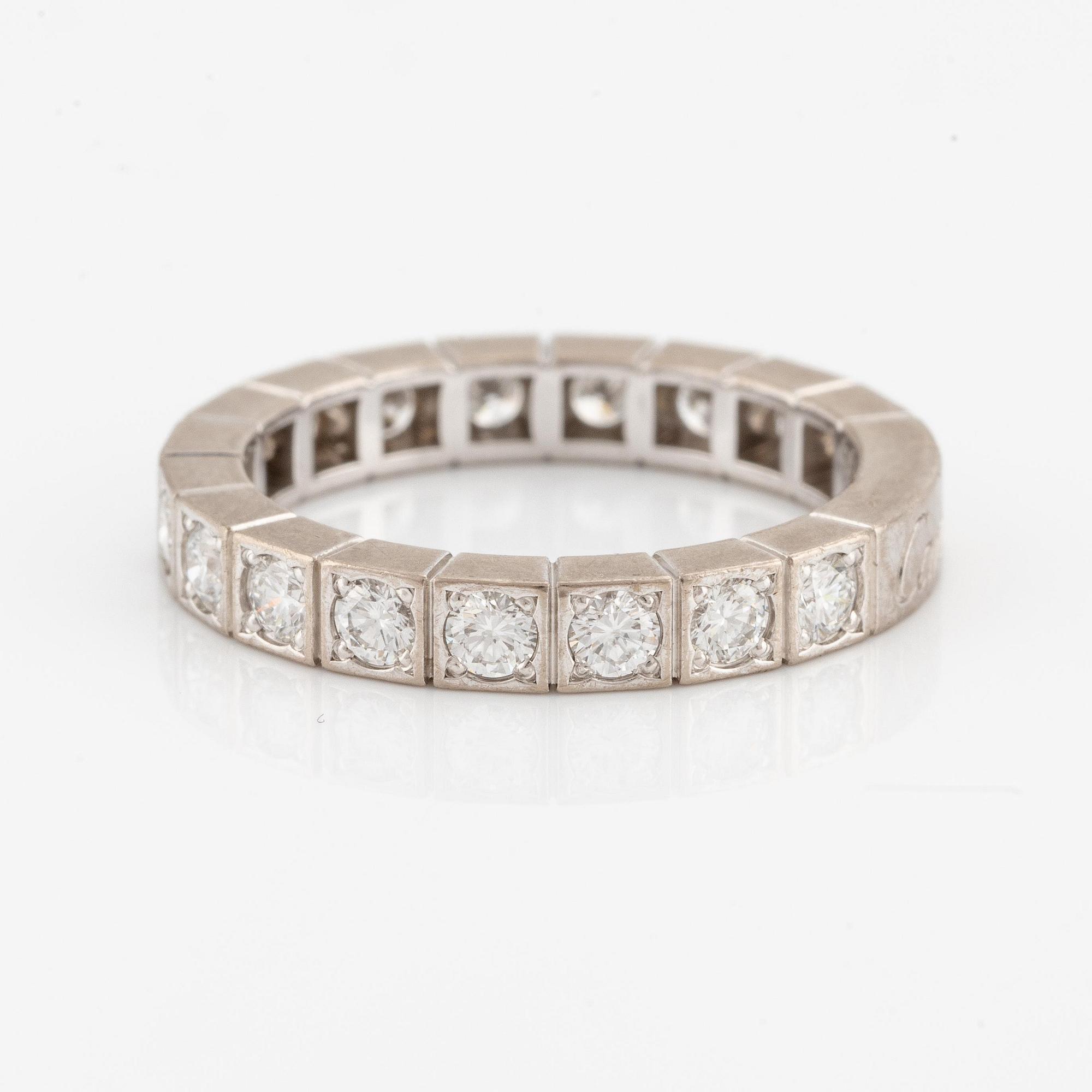 An 18K white gold Cartier ring set with round brilliant-cut diamonds.