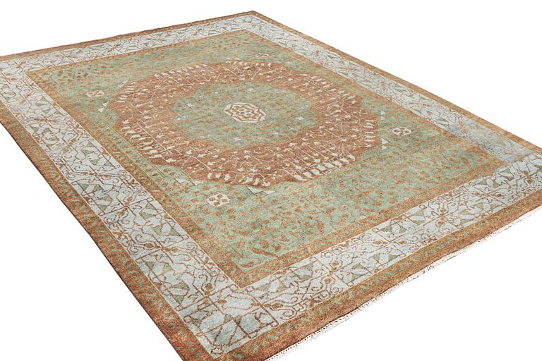 An oriental carpet with Mamluk design, c. 358 x 281 cm.