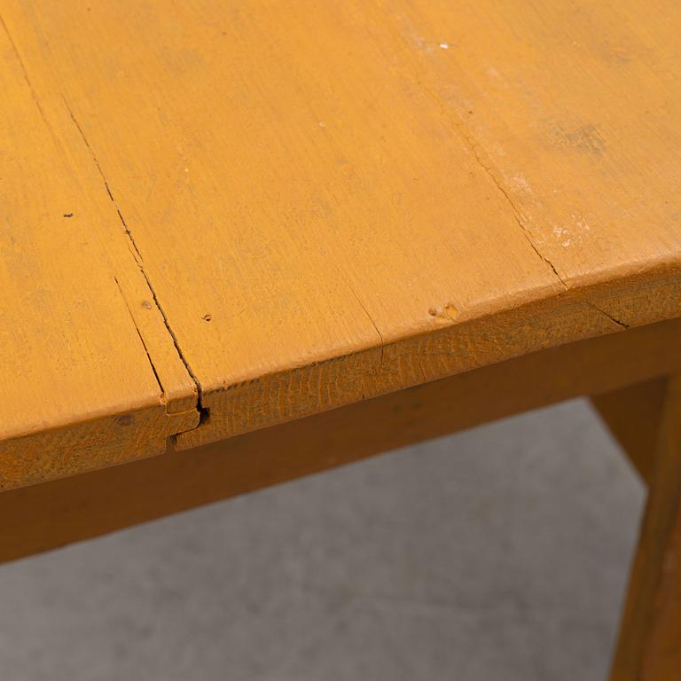 A drop-leaf table, circa 1900.