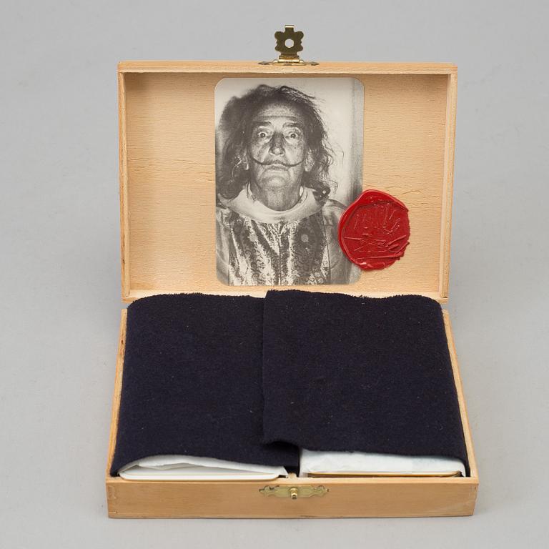 SALVADOR DALÍ, Two decks of playing cards designed by Salvador Dali in original wooden box with mounted photograph.