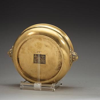 A polished bronze censer, Qing dynasty with Xuandes six character mark.