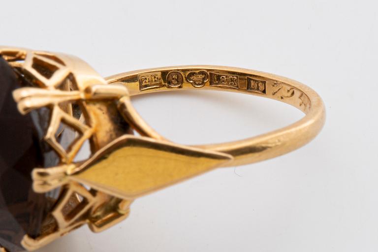 2 RINGS, 18K gold w smoky quartz approx 14 mm, silver and gold w rock crystal approx 16 mm, Stockholm 1963.