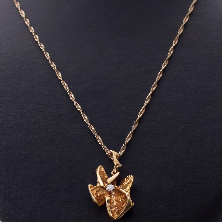 HÄNGE, 14K guld, briljantslipad diamant. Åbo, 1983. Vikt ca 9,1 g.