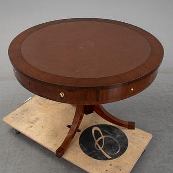 A revolving table, mid 19th century.