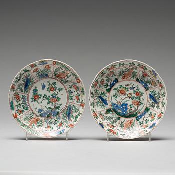 A pair of large famille verte cups with saucers, Qing dynasty, Kangxi (1662-1722).