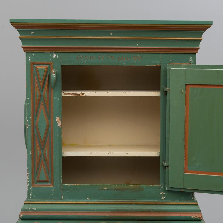 A second half of the 19th century wall cabinet with stand.