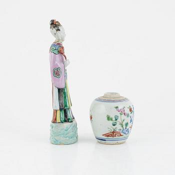 A Chinese famille rose porcelain figure and a jar, Qing dynasty (1644-1912).