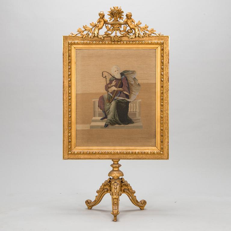 A late 19th century fire screen.
