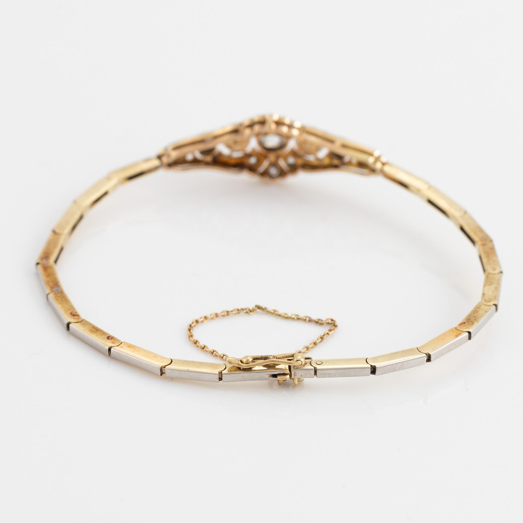 A 14K gold and platinum bracelet set with old- and rose-cut diamonds and pearls.