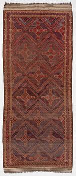 An antique Beshir carpet, ca 495 x 206 cm, around the year 1875.