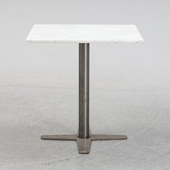 A marble top table, 21th century.