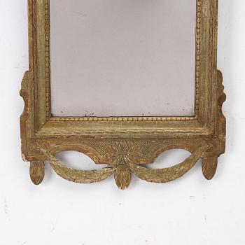 A Gustavian giltwood mirror, Stockholm, late 18th century.