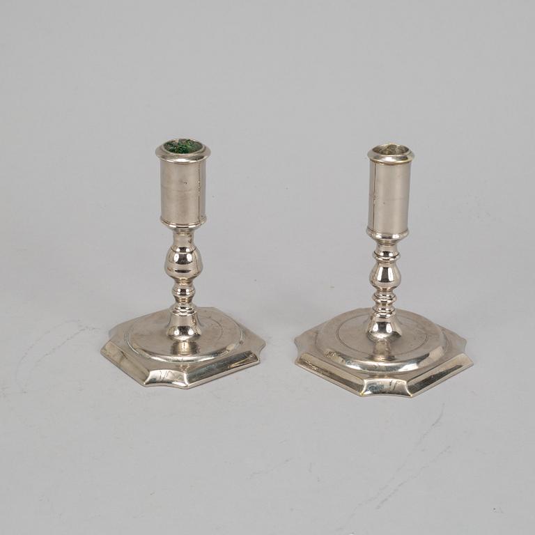 Two Swedish 18th century candlesticks.