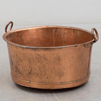 A 19th century copper cauldron.