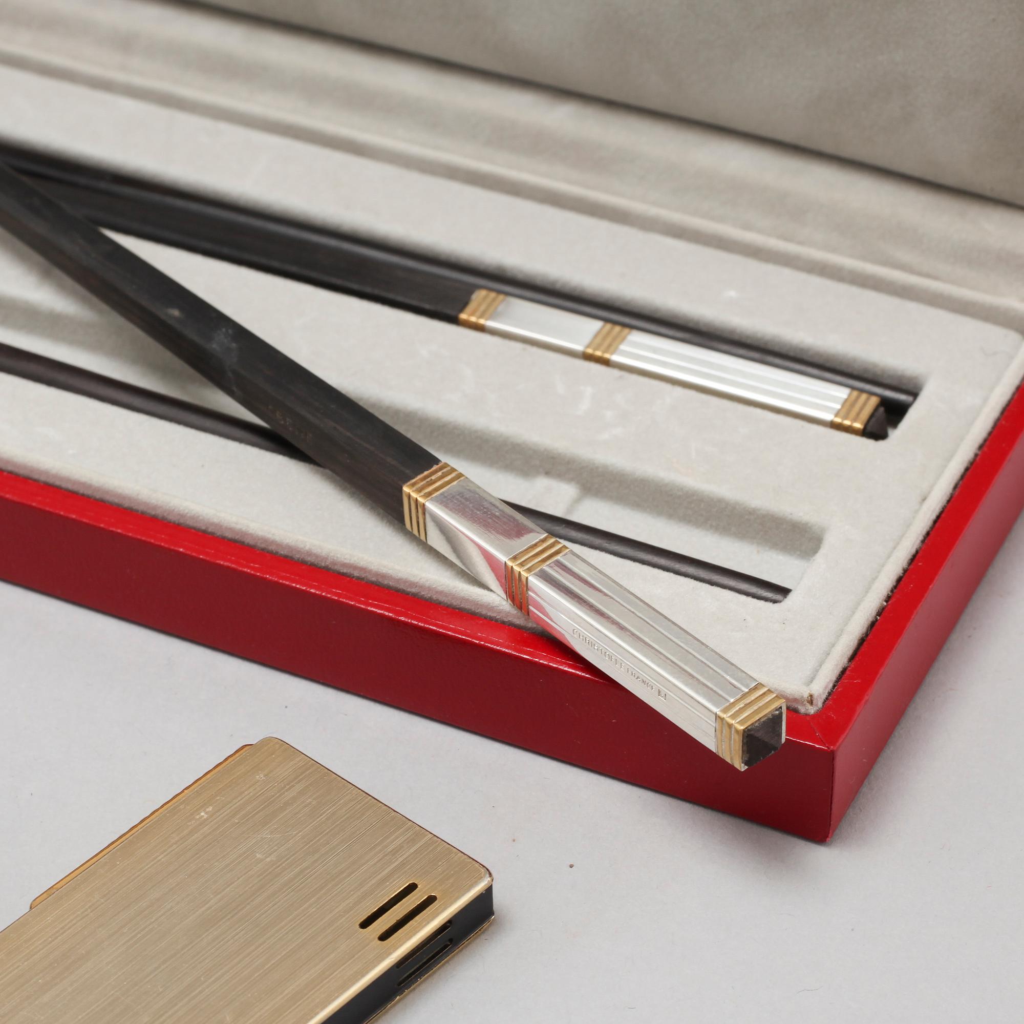 Three ligthers by Pierre Cardin, Ronson and Zippo and shopsticks and a scent bottle from Christofle.