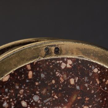 A pair of gilt silver and porphyry salts, by Gustaf Folcker, Stockholm 1827.